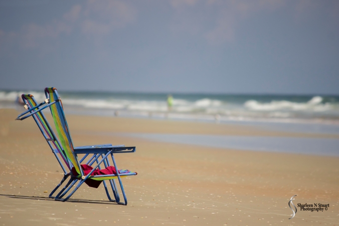Two lonesome chairs on the beach